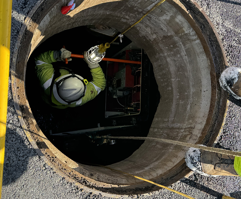 Worker in a Manhole