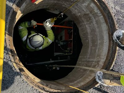 Worker in a Manhole